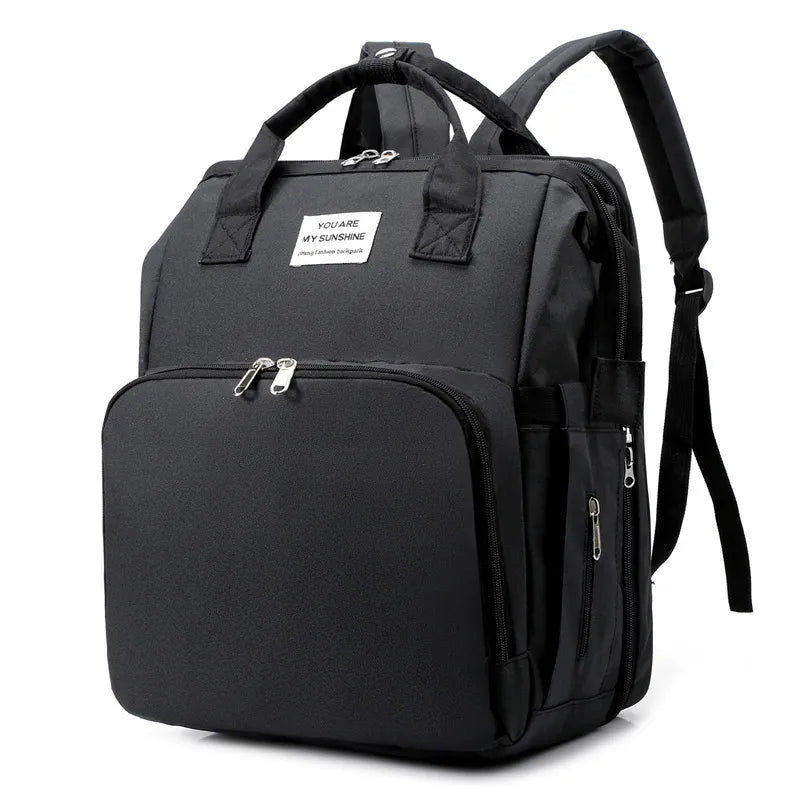 Black Fitlybuy waterproof mummy backpack with smart features, top handles, and multiple zippered compartments.