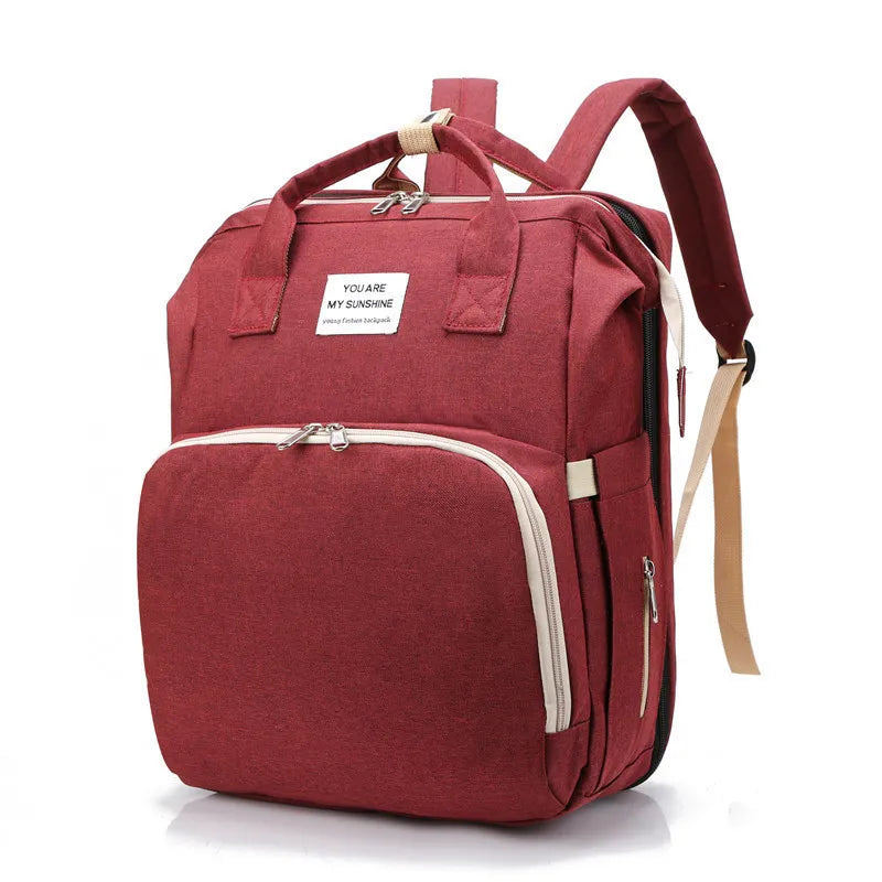 Red Fitlybuy waterproof mummy nappy backpack with "You Are My Sunshine" label, zipper pockets, and shoulder straps.