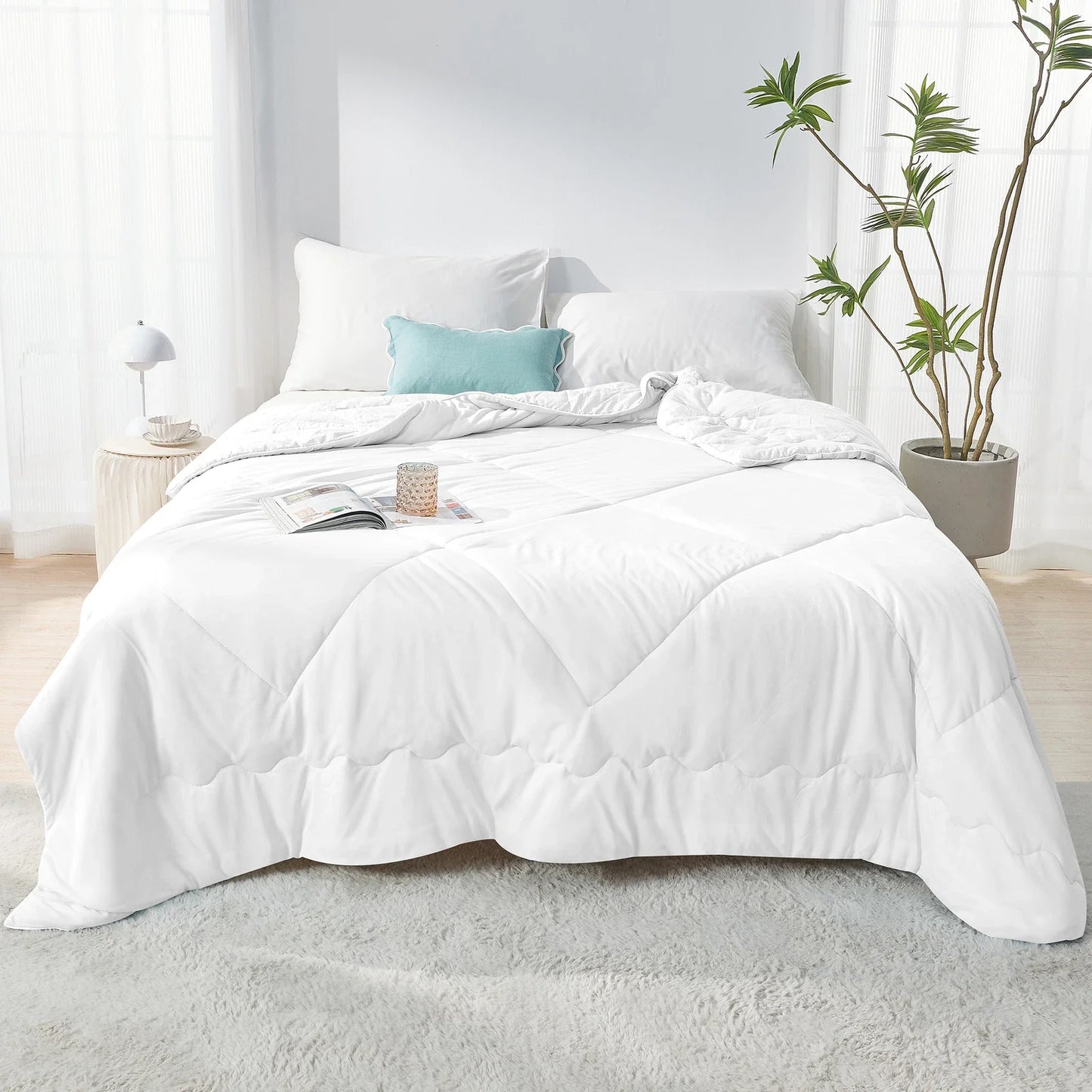 Fitlybuy Aussie Cool Ice Sleep Blanket in white with ChillTech fabric, displayed on a bed in a bright, modern room.