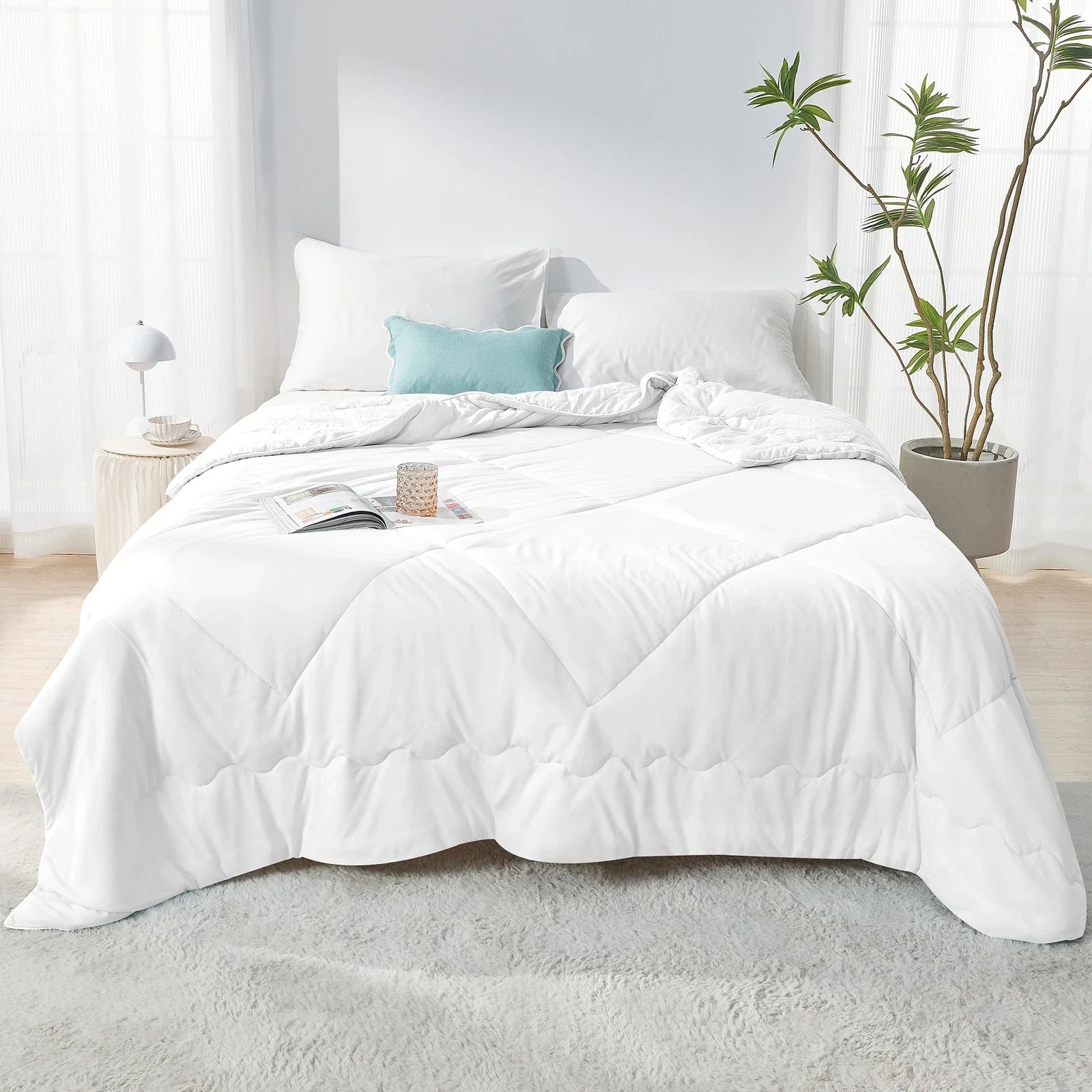 Fitlybuy Aussie Cool Ice Sleep Blanket in white with ChillTech fabric, displayed on a bed in a bright, modern room.