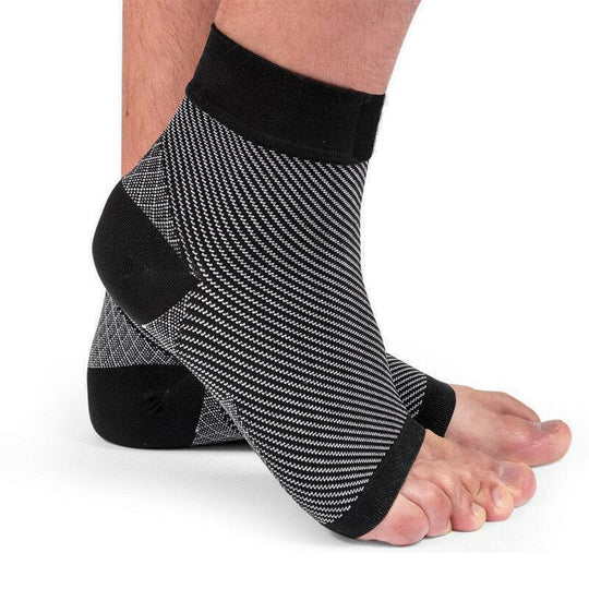 Fitlybuy black and white compression ankle sleeve with open-toe design for foot support on a person's foot.