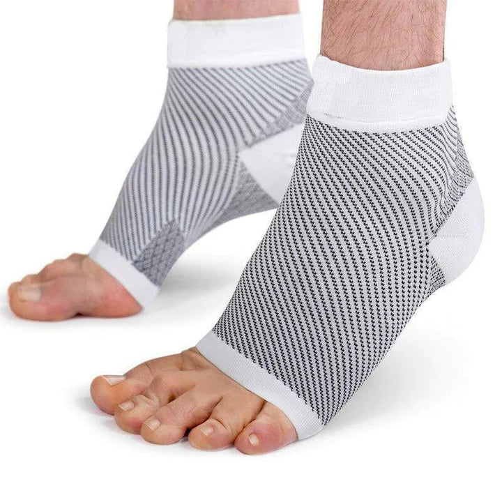 Fitlybuy white and grey compression foot and ankle sleeves with Advanced Support Technology worn on bare feet.
