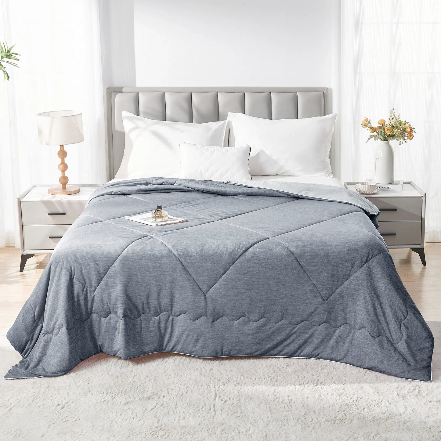 Fitlybuy Aussie Cool Ice Sleep Blanket in grey, featuring ChillTech fabric with a diamond-quilted pattern on a bed.