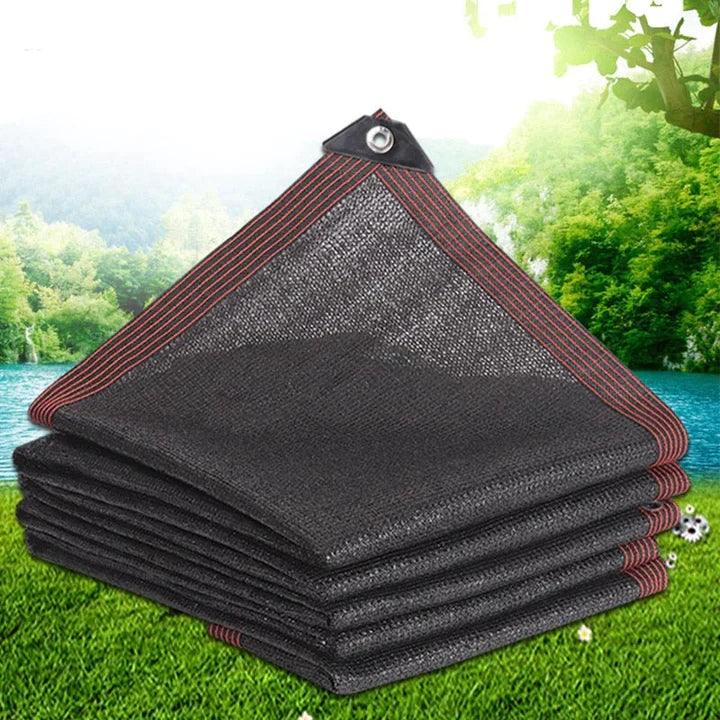 Fitlybuy black UV shade net with reinforced red-striped edges and grommets, displayed against a nature background.