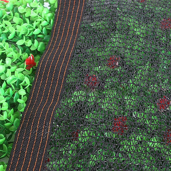 Fitlybuy black UV shade net featuring reinforced edges, shown covering green artificial foliage.