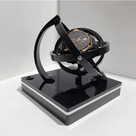 Fitlybuy luxury black automatic watch winder with a 360-degree rotating spherical design holding a skeleton watch.