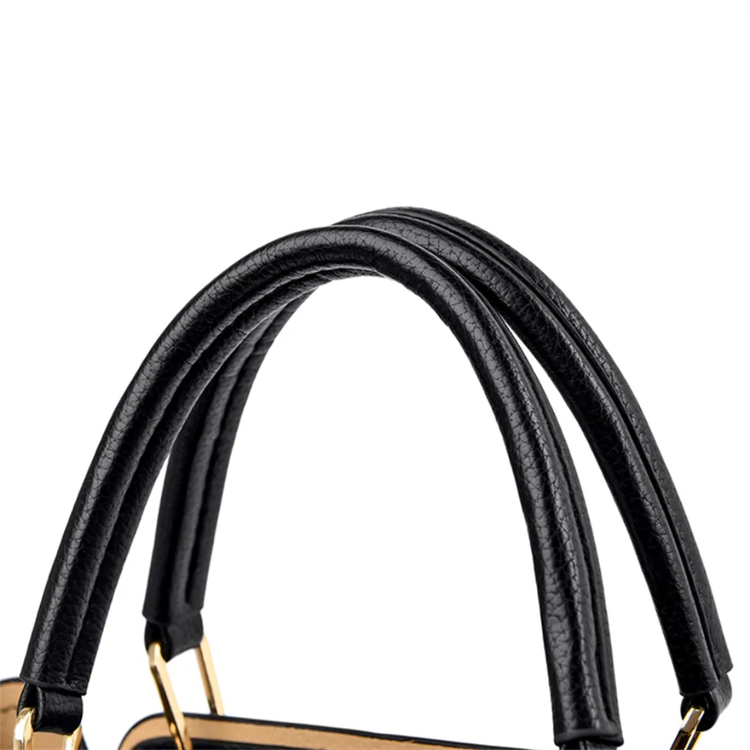 Close-up of the black pebbled PU leather handles on a Fitlybuy Vivian luxury shoulder bag with gold metal hardware.
