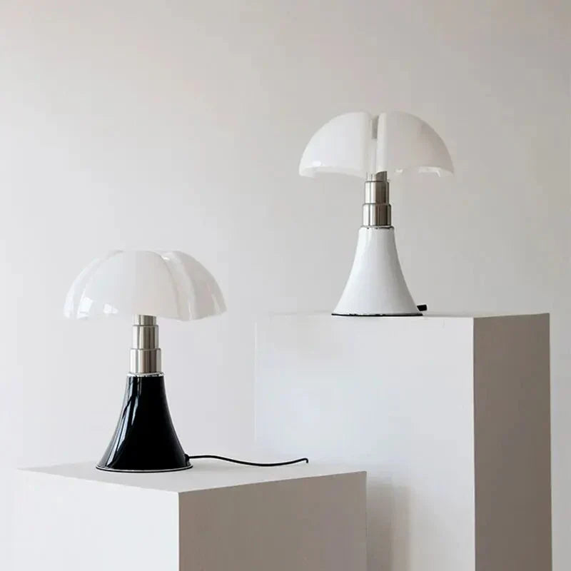 Two Fitlybuy FloraLuxe floral-shaped lamps with white and black bases and white glass domes on display pedestals.
