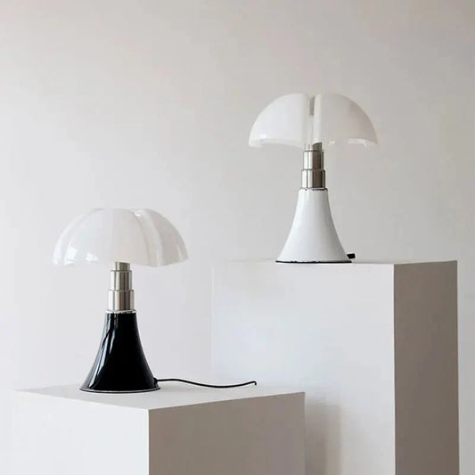 Two Fitlybuy FloraLuxe floral-shaped lamps with white and black bases and white glass domes on display pedestals.